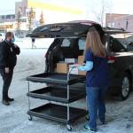 Ronald Lyon (left) and Jessica Hulet (right) prepare to offload doses of Pfizers COVID-19 vaccine at Central Peninsula Hospital on Wednesday, Dec. 16 in Soldotna, Alaska. (Ashlyn OHara/Peninsula Clarion)