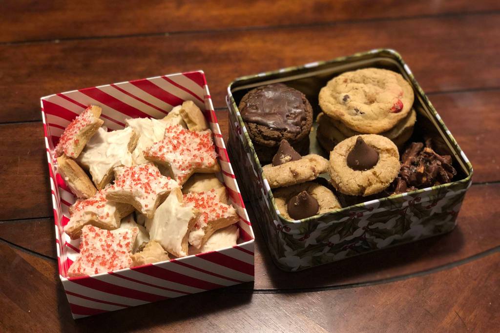 Two cookie boxes our household received from nearby friends, photographed on Dec. 21, 2020, in Anchorage, Alaska. (Photo by Victoria Petersen/Peninsula Clarion)