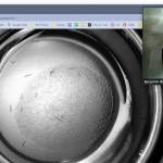 Homer High School alum and researcher Ben Blue shows biology students an image from the WormBot, part of a project to study the aging process they helped him remotely with during their second quarter. (Image courtesy Vicki Lowe)