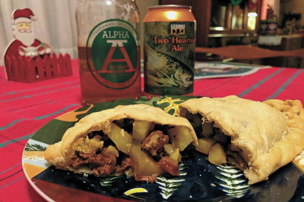 The finished product should have a light, flaky crust and moist fillings, as seen here on Christmas Day, Dec. 25, 2020 in Crystal Falls, Michigan. Finished off with a Michigan made beer, its hard to find a better second lunch/early dinner on Christmas Day. (Photo by Megan Pacer/Homer News)