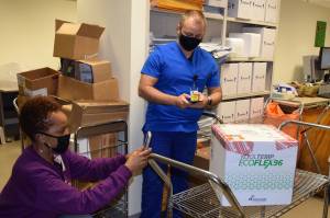 Photo courtesy of Alaska VA Healthcare System
Vallerie Card-King, L.CPht, and Bjorn Miller, Pharm D, document and verify the batch numbers of the Moderna Vaccine at the Alaska VA Healthcare System.