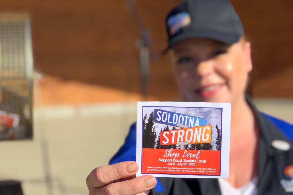 Shanon Davis, executive director of the Soldotna Chamber of Commerce, shows off a stamp card used in the Chambers Soldotna Strong Shop Local campaign on July 22, 2020. The City of Kenai is considering launching its own shop local program. (Photo courtesy Shanon Davis)