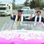 Nikiski High School seniors Hamilton Hammie Cox, left, and Martin Cox III, right, smile for the camera during the 2020 Nikiski High School Graduation Commencement Ceremony in Nikiski, Alaska on May 19, 2020. (Photo by Brian Mazurek/Peninsula Clarion)