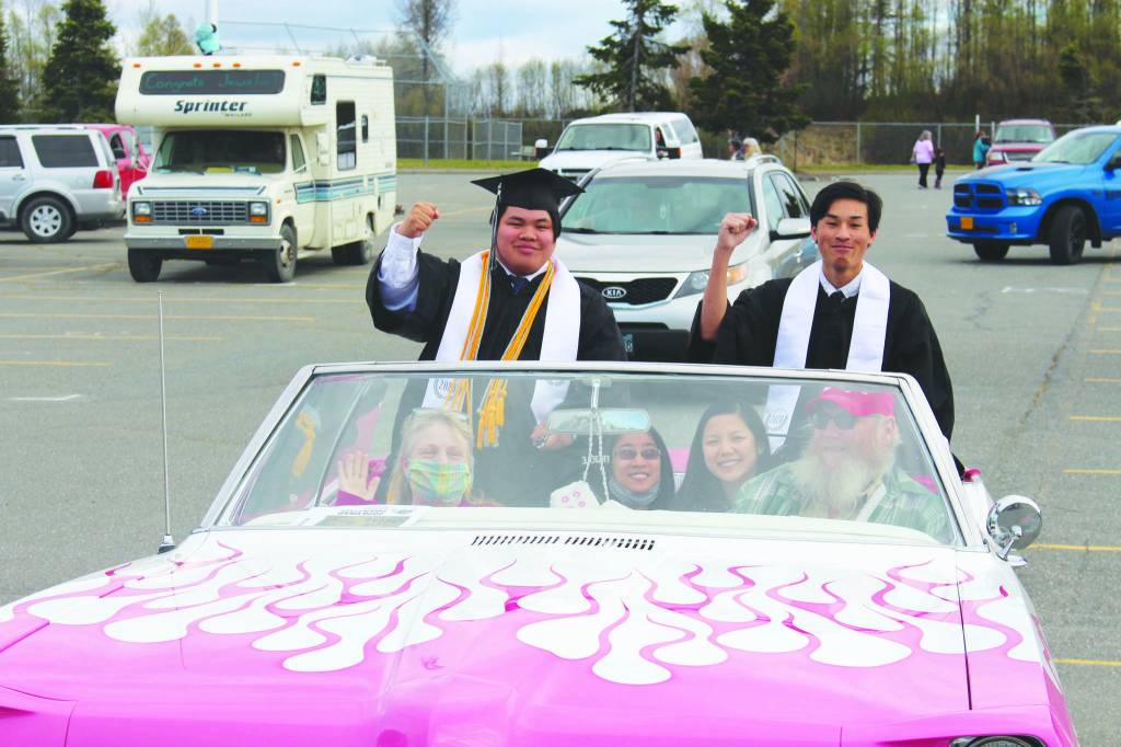 Nikiski High School seniors Hamilton Hammie Cox, left, and Martin Cox III, right, smile for the camera during the 2020 Nikiski High School Graduation Commencement Ceremony in Nikiski, Alaska on May 19, 2020. (Photo by Brian Mazurek/Peninsula Clarion)