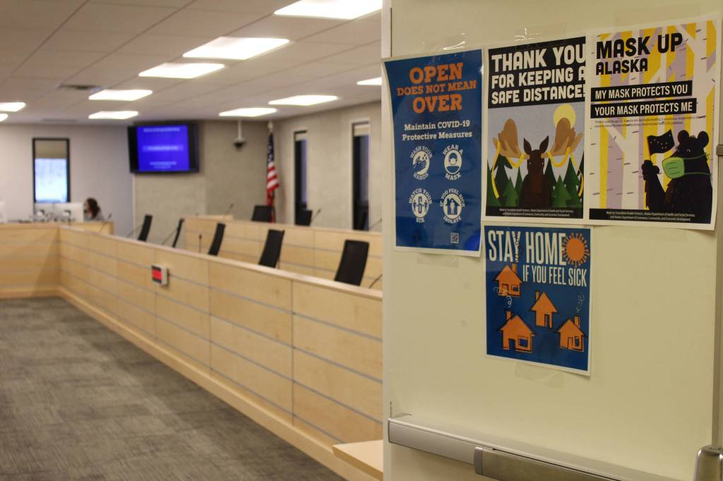 Signs promoting COVID-19 mitigation are seen outside of the Betty J. Glick Assembly Chamers on Monday, Jan. 4 in Soldotna, Alaska. (Ashlyn OHara/Peninsula Clarion)