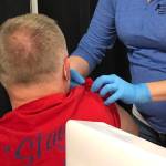 RN Rachel Verba (right) administers a dose of Pfizers COVID-19 vaccine to Dr. Chris Michelson (left) on Friday, Dec. 18, 2020 in Soldotna, Alaska. (Photo courtesy Bruce Richards/CPH)