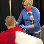 RN Rachel Verba (right) administers a dose of Pfizers COVID-19 vaccine to Dr. Chris Michelson (left) on Friday, Dec. 18, 2020 in Soldotna, Alaska. (Photo courtesy Bruce Richards/CPH)