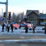 Demonstrators gather at the intersection of Kenai Spur and Sterling higways on Wednesday, Jan. 6 in Soldotna, Alaska. (Ashlyn OHara/Peninsula Clarion)