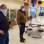 Vaughn Dosko (left) and Mike Tilly (right) discuss COVID-19 mitigation in the lunchroom at Kenai Middle School on Friday, Jan. 8 in Kenai, Alaska. (Ashlyn OHara/Peninsula Clarion)
