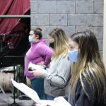 Members of the Kenai Performers rehearse a scene from Murder in the Cathedral at the Kenai Performers black box theater in Soldotna, Alaska, on Jan. 16, 2021. From left: Nikki Stein, Hannah Burton and Sylvia McGraw. (Photo by Brian Mazurek/Peninsula Clarion)