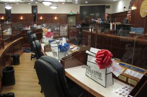 AP Photo / Becky Bohrer 
Welcome bags and plexiglass dividers placed around their desks await lawmakers on the Alaska House floor in Juneau. The committee was among several that had scheduled meetings Monday, the last day before the new Legislature is set to convene Tuesday.