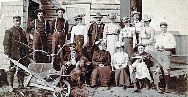 Photo from the Alaska Digital Archives 
White men and women in Kenai tended to congregate with people like themselves. This typical outing, in Kasilof, includes (far left, back row) Hans P. Nielsen, superintendent of the Agricultural Experiment Station.