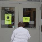 A Kenai Peninsula Resident walks in to the Soldotna Prep School for her vaccine appointment during a clinic hosted by the Kenai Peninsula Borough and Soldotna Professional Pharmacy in Soldotna, Alaska on Jan. 23, 2021. (Photo by Brian Mazurek/Peninsula Clarion)