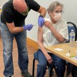 EMT Jason Tauriainen administers a COVID-19 vaccine on Saturday, Jan. 23 in Nikiski, Alaska. (Photo courtesy of the Nikiski Senior Center)