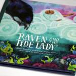 This photo shows the cover of Raven and the Tide Lady, which was illustrated by Michaela Goade. It is part of Sealasha Heritage Institutes Baby Raven Reads series of books. The Baby Raven Reads program helped Michaela Goade, who is now a Caldecott Medal winner, get started in illustrating childrens books, the artist said during an interview with the Empire. (Ben Hohenstatt / Juneau Empire)