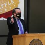 Mike Barnhill, deputy commisioner of the Alaska Department of Revenue, speaks following the drawing of names during the second annual PFD Education Raffle. During the event, state officials and lawmakers wore masks with an education raffle logo. (Ben Hohenstatt / Juneau Empire)