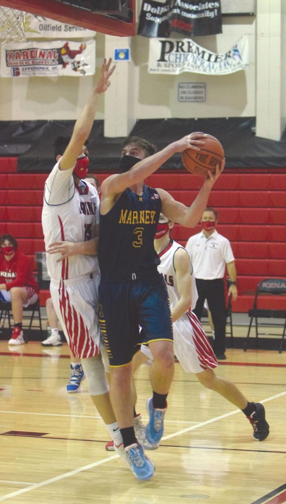 Kenai Centrals Jordan Kvasnikoff defends Homers Clayton Beachy on Thursday, Jan. 28, 2021, at Kenai Central High School in Kenai, Alaska. (Photo by Jeff Helminiak/Peninsula Clarion)