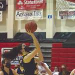 Homers Delilah Harris goes up for a shot against Kenai Centrals Erin Koziczkowski on Thursday, Jan. 28, 2021, at Kenai Central High School in Kenai, Alaska. (Photo by Jeff Helminiak/Peninsula Clarion)