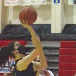 Homer's Delilah Harris goes up for a shot against Kenai Central's Erin Koziczkowski on Thursday, Jan. 28, 2021, at Kenai Central High School in Kenai, Alaska. (Photo by Jeff Helminiak/Peninsula Clarion)