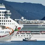 Michael Penn / Juneau Empire File
A fishing vessel is drawfed by the Norwegian Cruise Lines Norwegian Jewel and Norwegian Pearl in Juneaus downtown harbor in September 2014. On Thursday, Canada announced a ban on cruise vessels in Canadian waters through February 2022.
