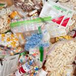 Prescriptions drugs, vitamins, hormones, and other drugs left in the drug drop box in the lobby of the Juneau Police Department in September 2019.The drop box gives residents a safe place to disposed of their unused prescription narcotics. The state announced on Thursday it will receive more than $1 million as part of a settlement with a consulting firm accused of turbocharging the opioid epidemic. (Michael Penn / Juneau Empire File)