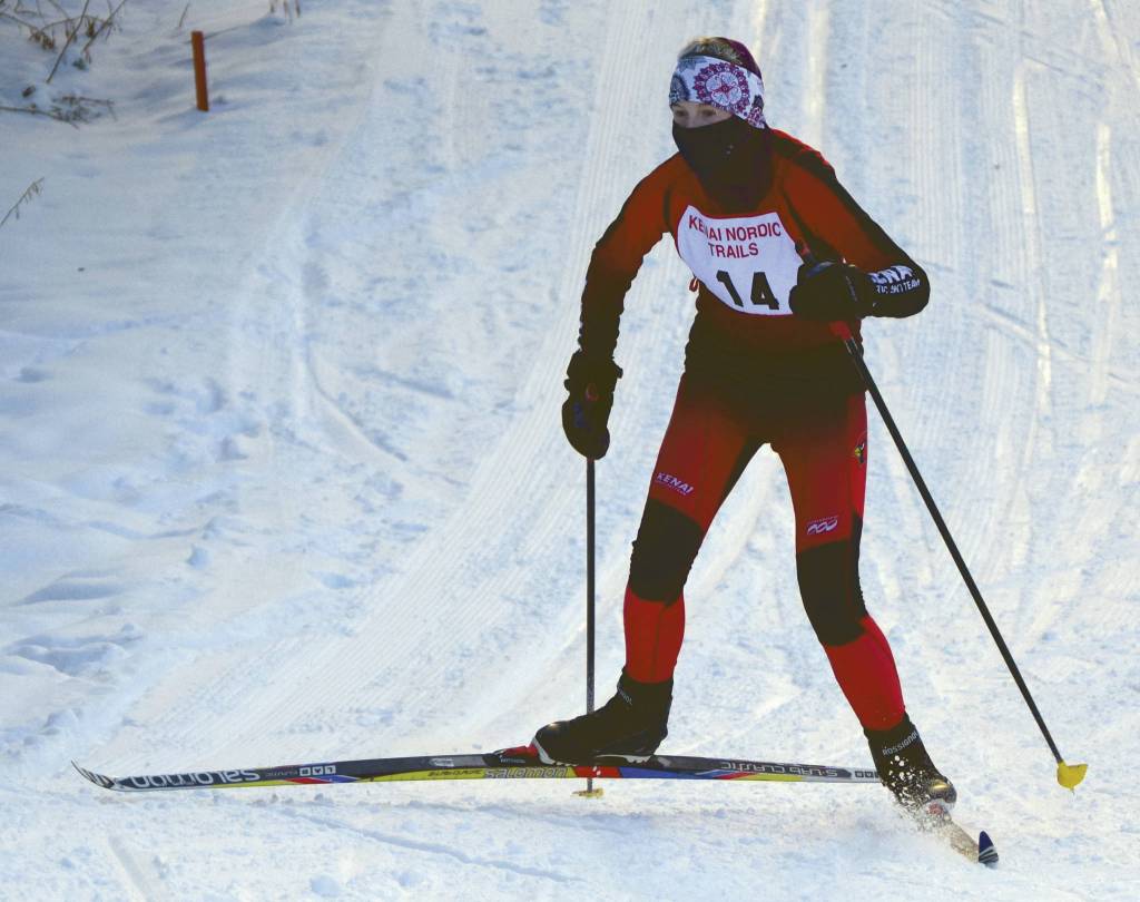Elizabeth Moffet skis up a hill during the Kenai Klassic on Saturday, Feb. 6, 2021, at the Kenai Nordic Trails in Kenai, Alaska. (Photo by Jeff Helminiak/Peninsula Clarion)