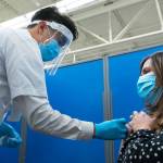 A Walmart pharmacy manager administers a dose of a COVID-19 vaccine to a patient. (Photo courtesy of Walmart)