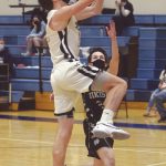 Soldotnas Ethan Sewell goes up for a layup against Nikiskis Kyle Malston on Saturday, Feb. 13, 2021, at Soldotna High School in Soldotna, Alaska. (Photo by Jeff Helminiak/Peninsula Clarion)