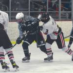 Soldotna's Dylan Walton attacks Kenai's Central's Hunter Erwin and Daniel Shelden on Saturday, Feb. 13, 2021, at the Kenai Multi-Purpose Facility in Kenai, Alaska. (Photo by Jeff Helminiak/Peninsula Clarion)
