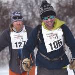 Sam Spencer, Erik Route and Josiah Brown, all of Cooper Landing, near the finish of the 20-kilometer classic race Sunday, Feb. 21, 2021, at Tsalteshi Trails just outside of Soldotna, Alaska. (Photo by Jeff Helminiak/Peninsula Clarion)