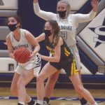 Soldotnas Morgan Bouschor looks for an outlet pass under pressure from Sewards Shelby Sieminski as Soldotnas Taylor Edwards looks on at Soldotna High School on Tuesday, Feb. 23, 2021, in Soldotna, Alaska. (Photo by Jeff Helminiak/Peninsula Clarion)