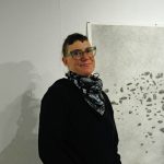 Michael Armstrong / Homer News
Bunnell Street Arts Center Artist in Residence Nina Elder stands next to a drawing from her series, It Will Not Be the Same, But It Might Be Beautiful, drawings of puzzle stones collected in the area near McCarthy.