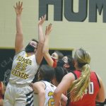 Homers Tonda Smude scores against Kenai Central on Friday, March 12, 2021, at the Southcentral Conference tournament at Nikiski High School in Nikiski, Alaska. (Photo by Jeff Helminiak/Peninsula Clarion)