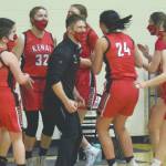 Head coach Jeff Swick and the Kenai Central girls basketball team celebrate earning a berth in the Class 3A state tounament after defeating Homer in the semifinals of the Southcentral Conference girls tournament Friday, March 12, 2021, at Nikiski High School in Nikiski, Alaska. (Photo by Jeff Helminiak/Peninsula Clarion)