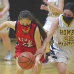 Kenai Centrals Emilee Wilson and Homers Hannah Hatfield battle for the ball Friday, March 12, 2021, at the Southcentral Conference tournament at Nikiski High School in Nikiski, Alaska. (Photo by Jeff Helminiak/Peninsula Clarion)