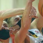 Houston's Hunter Jefferson and Homer's Clayton Beachy battle for the rebound Saturday, March 13, 2021, in the third-place game of the Southcentral Conference boys tournament at Kenai Central High School in Kenai, Alaska. (Photo by Jeff Helminiak/Peninsula Clarion)