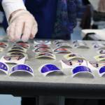 An election official lays out more I voted stickers on Tuesday, Nov. 3. Stickers for the 2020 general election featured designs by Alaskan artist Barbara Lavallee. (Ben Hohenstatt / Juneau Empire File)