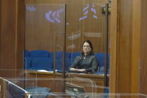Alaska state Sen. Lora Reinbold sits in a Senate gallery on Friday, in Juneau. The Alaska Senate voted Wednesday to allow leadership to restrict access to the Capitol by Reinbold, an Eagle River Republican, over violations of protocols meant to guard against COVID-19. (AP Photo/Becky Bohrer, Pool)