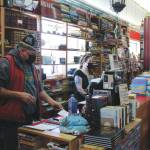 Benjamin Jackinsky (left) and Sarah OBrien conduct business in Already Read on Friday, Feb. 19 in Kenai, Alaska.