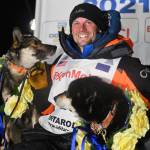 Dallas Seavey poses with his dogs after winning the Iditarod Trail Sled Dog Race race near Willow, Alaska, early Monday, March 15, 2021. (Marc Lester/Anchorage Daily News via AP, Pool)