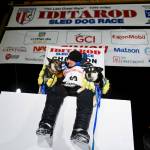 Dallas Seavey poses with his dogs North, left, and Gamble after winning the Iditarod Trail Sled Dog Race race near Willow, Alaska, early Monday, March 15, 2021. (Marc Lester/Anchorage Daily News via AP, Pool)