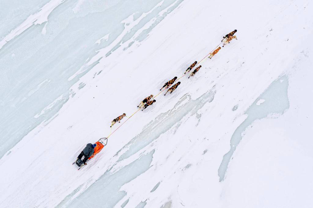 Joar Leifseth Ulsom mushes across Finger Lake, in Alaska, on Sunday, March 14, 2021, during the Iditarod. (Loren Holmes/Anchorage Daily News via AP, Pool)