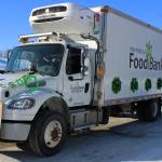 People with the Kenai Peninsula Food Bank are seen throwing candy during the 30th Annual Sweeneys St. Patricks Day Parade on Wednesday, March 17 in Soldotna, Alaska. (Ashlyn OHara/Peninsula Clarion)