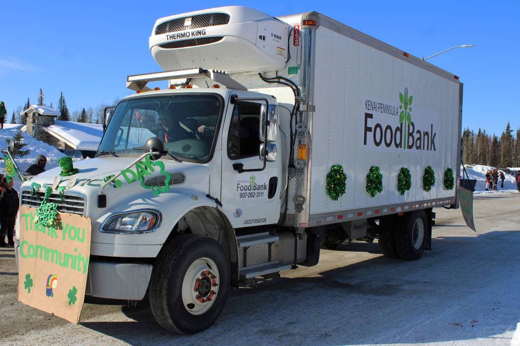 People with the Kenai Peninsula Food Bank are seen throwing candy during the 30th Annual Sweeneys St. Patricks Day Parade on Wednesday, March 17 in Soldotna, Alaska. (Ashlyn OHara/Peninsula Clarion)