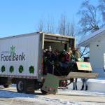People with the Kenai Peninsula Food Bank are seen throwing candy during the 30th Annual Sweeneys St. Patricks Day Parade on Wednesday, March 17 in Soldotna, Alaska. (Ashlyn OHara/Peninsula Clarion)