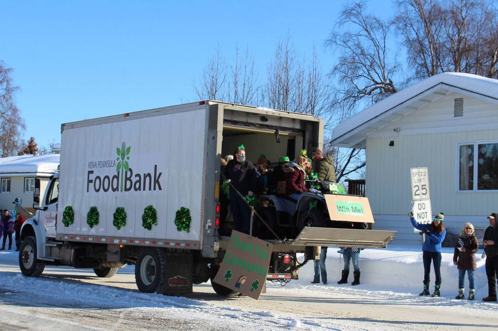 People with the Kenai Peninsula Food Bank are seen throwing candy during the 30th Annual Sweeneys St. Patricks Day Parade on Wednesday, March 17 in Soldotna, Alaska. (Ashlyn OHara/Peninsula Clarion)