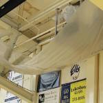 A large tarp hangs in the Homer High School gymnasium to catch water leaking through the roof at the school in Homer, Alaska. (Photo courtesy Doug Waclawski)
