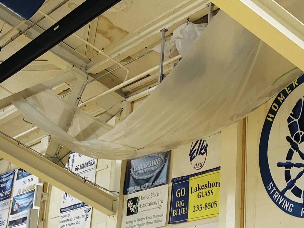 A large tarp hangs in the Homer High School gymnasium to catch water leaking through the roof at the school in Homer, Alaska. (Photo courtesy Doug Waclawski)