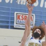 Cook Inlet Academy's Mason Zeigler goes up for a shot against Birchwood Christian's Tyler Huston at the Peninsula Conference tournament Thursday, March 18, 2021, at Soldotna High School in Soldotna, Alaska. (Photo by Jeff Helminiak/Peninsula Clarion)