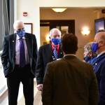 Masked House Republicans meet in the hallway of the Alaska State Capitol on Friday, March 19, 2021, to discuss Rep. Chris Kurkas refusal to remove a controversial mask. (Peter Segall / Juneau Empire)